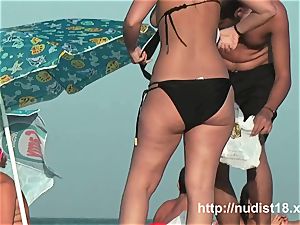 naked beach spycam movie of super-hot playful nudists in water